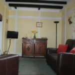 Sofa and chair plus tv in lounge of Lodge