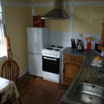 Fridge, cooker and sink in the Lodge kitchen area